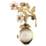 Vintage 9k gold Ladies Rotary pendant watch, floral, Garnet and Pearl brooch